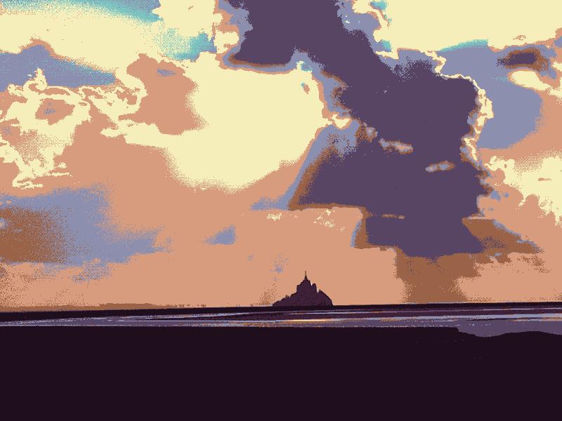 Photo of the Mt St Michel, with clouds letting the sun go trough